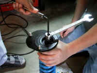 Assembling_Strut_and_Upper_Strut_Mount.jpg (30640 bytes)